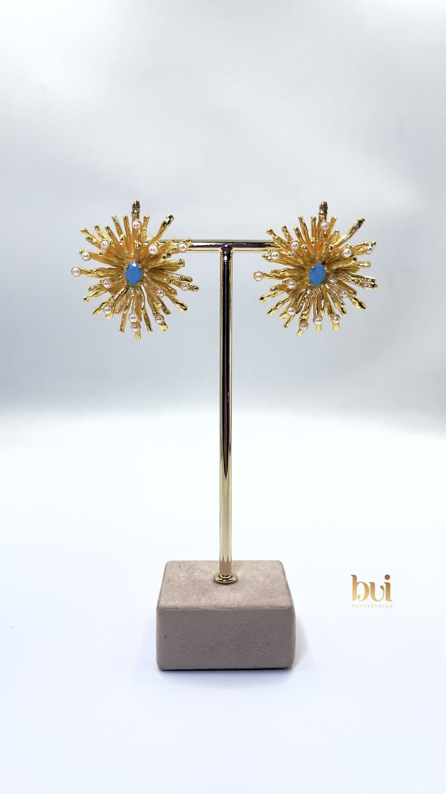The Gold Sunburst Earrings.